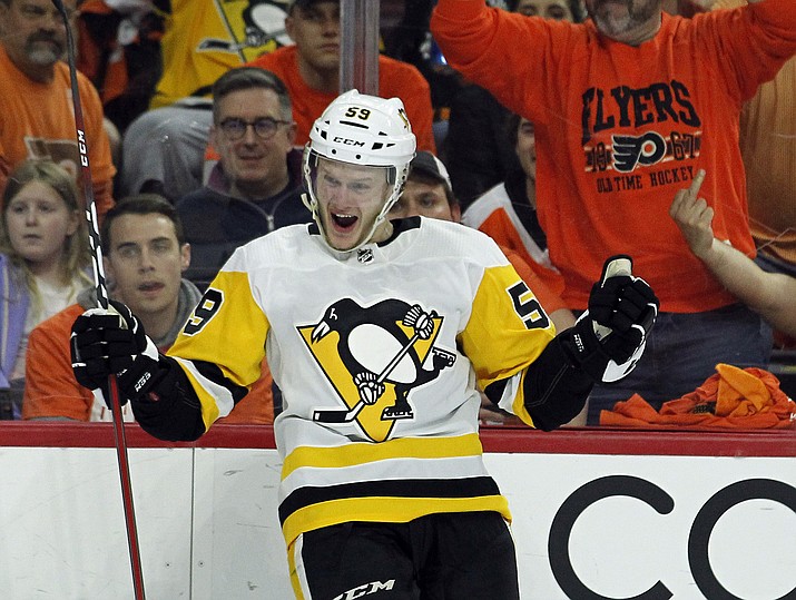 Pittsburgh Penguins' Jake Guentzel, celebrates his goal during the third period in Game 6 of an NHL first-round hockey playoff series Sunday, April 22, 2018, in Philadelphia. (Tom Mihalek/AP)