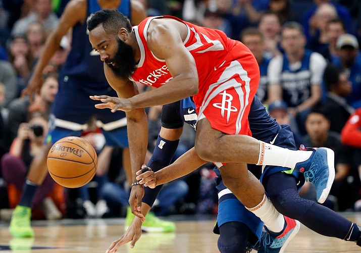 Houston Rockets' James Harden, front, and Minnesota Timberwolves' Taj Gibson become entangled while chasing the ball during the first half of Game 4 in an NBA basketball first-round playoff series Monday, April 23, 2018, in Minneapolis. (Jim Mone/AP)