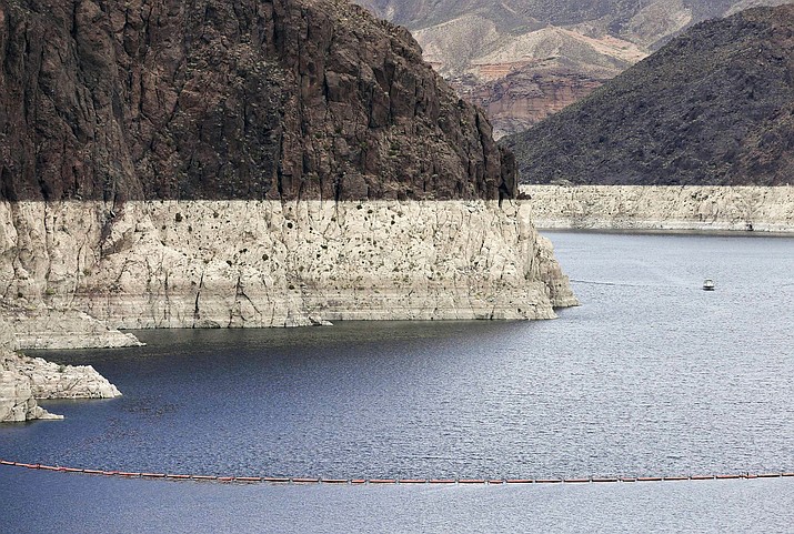 A 2013 photo shows the "bathtub ring," a high water mark on Lake Mead near Boulder City, Nevada. Tension among U.S. states that rely on the Colorado River escalated into a public feud when an Arizona water provider was accused of manipulating the level of Lake Mead amid a prolonged drought. (AP Photo/Julie Jacobson, File)