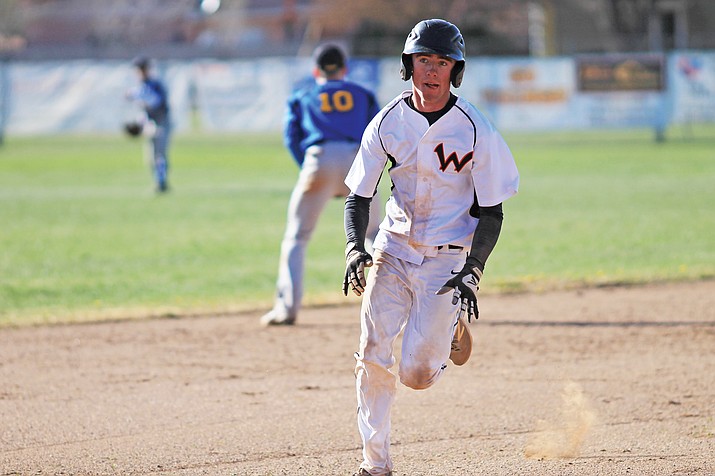 Viking Michael McNelly heads to third base during the game with Ash Fork April 19.