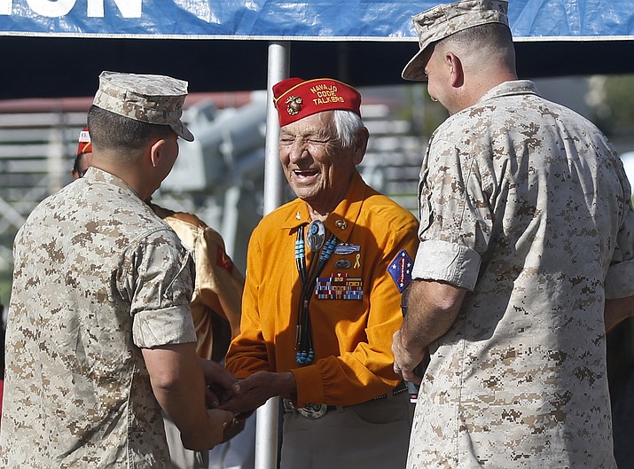 In this Sept. 28, 2015, file photo, former United States Marine and Navajo Code Talker Roy Hawthorne Sr., center, talks with Marines including Major Gen. Daniel O'Donohue, right, at a ceremony honoring the code talkers and their contributions to the U.S. war effort in World War II, at Camp Pendleton, California. The Navajo Nation says Hawthorne Sr. died April 21. He was 92. Hawthorne enlisted in the U.S. Marine Corps at age 17 and became part of a famed group of Navajos who transmitted hundreds of messages in their language without error. The code was never broken. (AP Photo/Lenny Ignelzi, File)