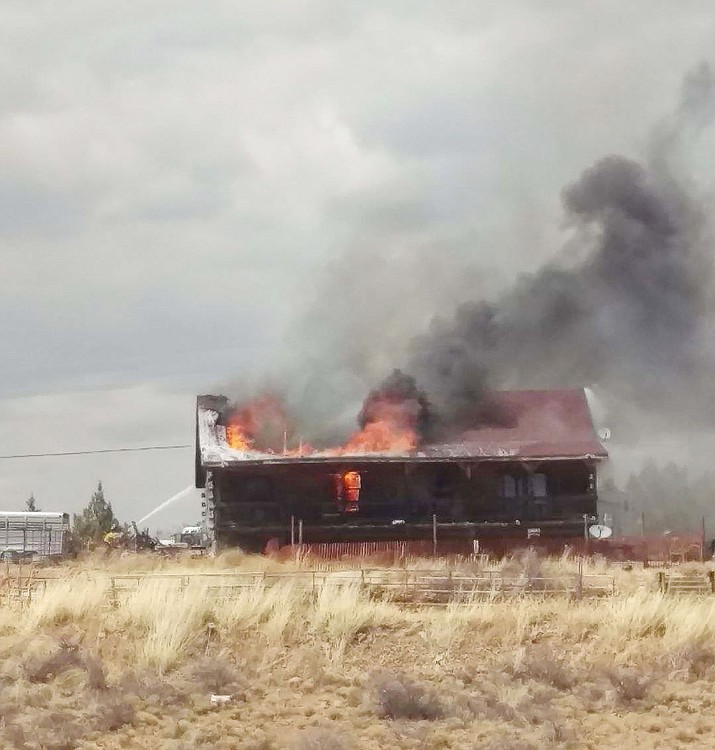 Central Arizona Fire and Medical Authority crews work to extinguish a home fire near the intersection of Cranberry Road and Tonto Drive midday Thursday, April 27. (Daphane Shaughnessy/Courtesy)