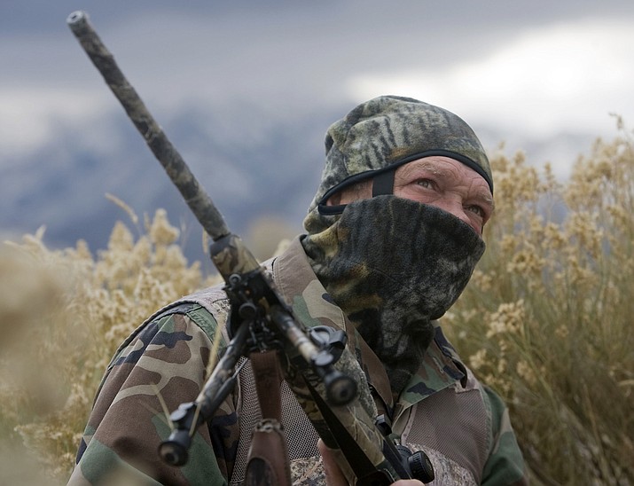 In this photo taken Nov. 30, 2011,  William Keebler appears in camouflage in Vernon, Utah. (Al Hartmann/The Salt Lake Tribune via AP)