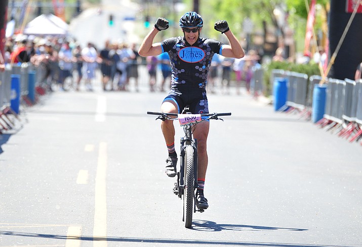 Joe Susco celebrates his overall and men’s masters (45 and over) win in the 30-mile race during the Whiskey Off-Road 30- and 50-mile amateur races in Prescott Saturday, April 28, 2018. (Les Stukenberg/Courier)