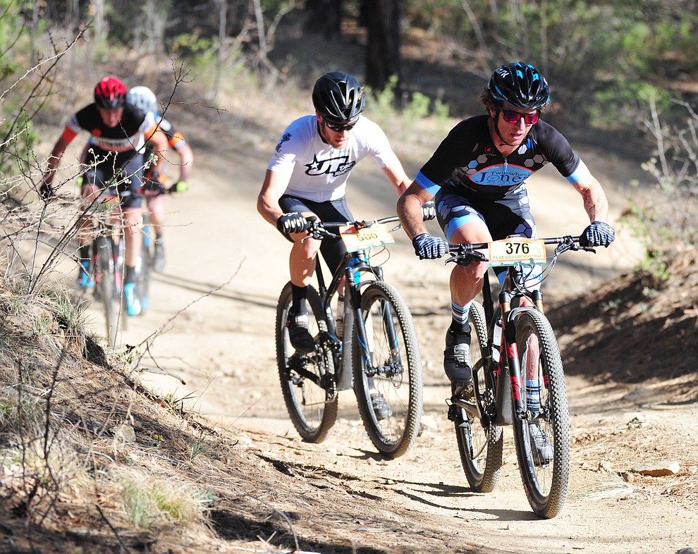 Travis Waldron leads a mall group during the Whiskey Off Road 30 and 50 mile amateur races in Prescott Saturday, April 28, 2018. (Les Stukenberg/Courier)