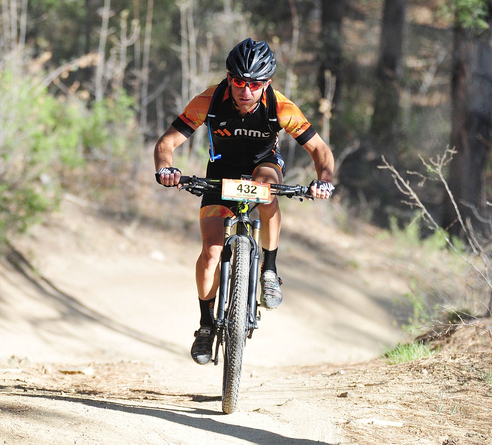 Tim Racette heads towards the single track during the Whiskey Off Road 30 and 50 mile amateur races in Prescott Saturday, April 28, 2018. (Les Stukenberg/Courier)