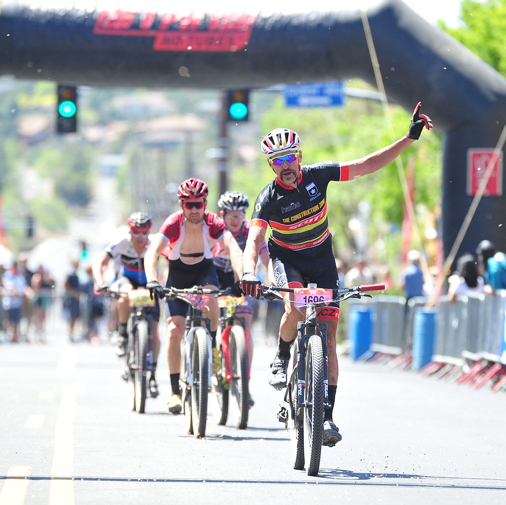 Sean Hahn crosses the finish line during the Whiskey Off Road 30 and 50 mile amateur races in Prescott Saturday, April 28, 2018. (Les Stukenberg/Courier)