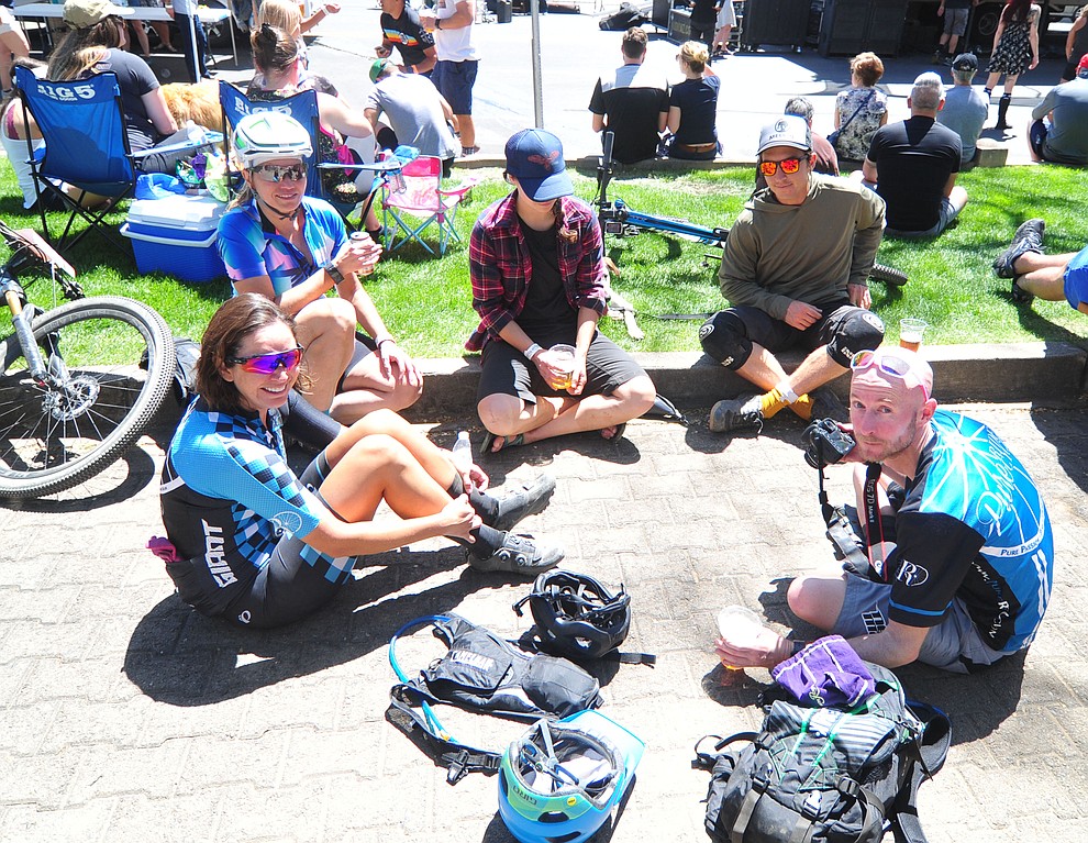 A beer and friendship following the Whiskey Off Road 30 and 50 mile amateur races in Prescott Saturday, April 28, 2018. (Les Stukenberg/Courier)