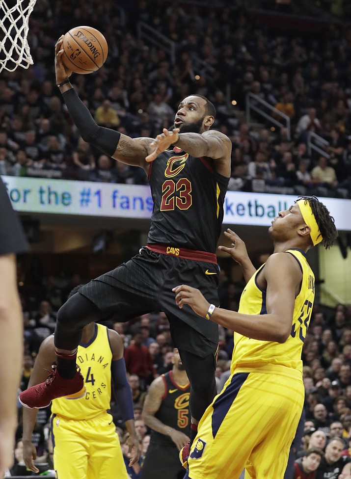 Cleveland Cavaliers’ LeBron James (23) drives to the basket against Indiana Pacers’ Myles Turner (33) in the first half of Game 7 of an NBA basketball first-round playoff series, Sunday, April 29, 2018, in Cleveland. (Tony Dejak/AP)