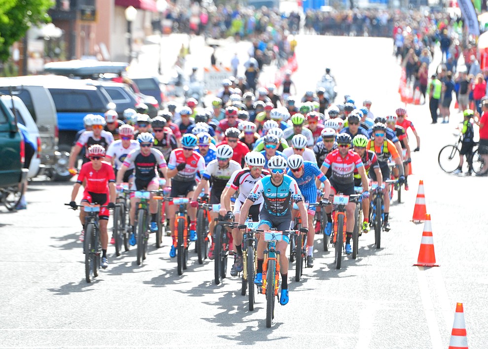 Men head up to the hills from downtown during the Whiskey Off Road 50-mile professional race in Prescott Sunday, April 29, 2018. (Les Stukenberg/Courier)