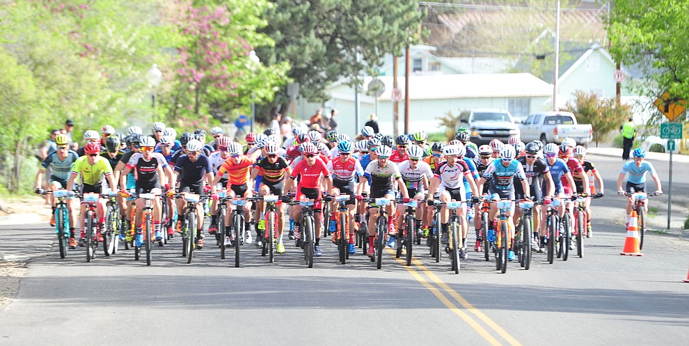 Men head up to the hills from downtown during the Whiskey Off Road 50-mile professional race in Prescott Sunday, April 29, 2018. (Les Stukenberg/Courier)