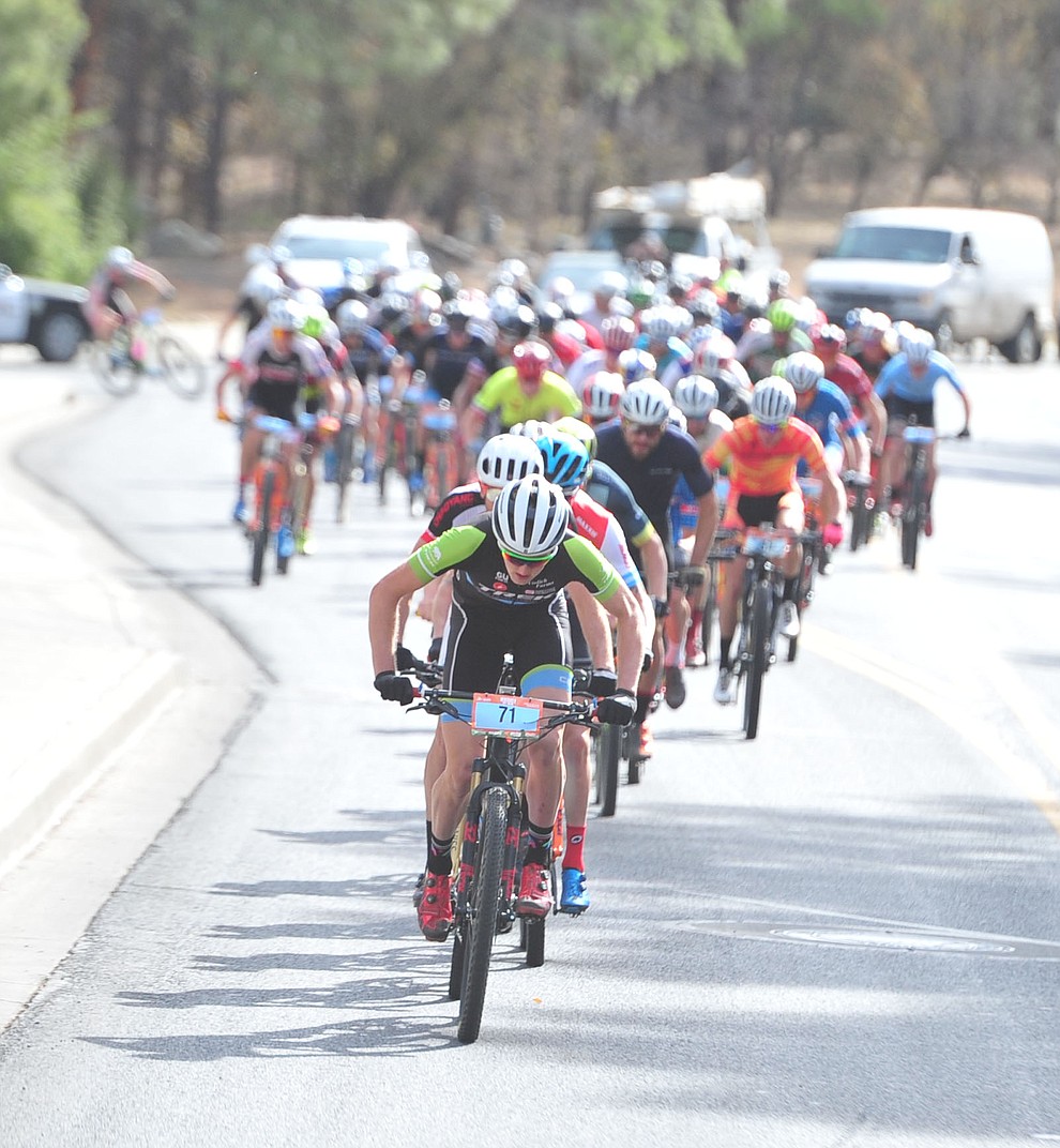 Paul Fabian leads the men as they head up to the hills from downtown during the Whiskey Off Road 50-mile professional race in Prescott Sunday, April 29, 2018. (Les Stukenberg/Courier)