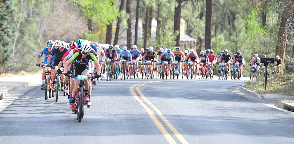 Paul Fabian leads the men as they head up to the hills from downtown during the Whiskey Off Road 50-mile professional race in Prescott Sunday, April 29, 2018. (Les Stukenberg/Courier)