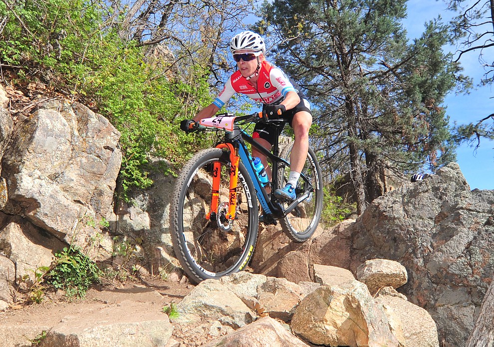 Chloe Woodruff goes through a technical section on trail 48 during the Whiskey Off Road 50 mile professional race in Prescott Sunday, April 29, 2018. (Les Stukenberg/Courier)
