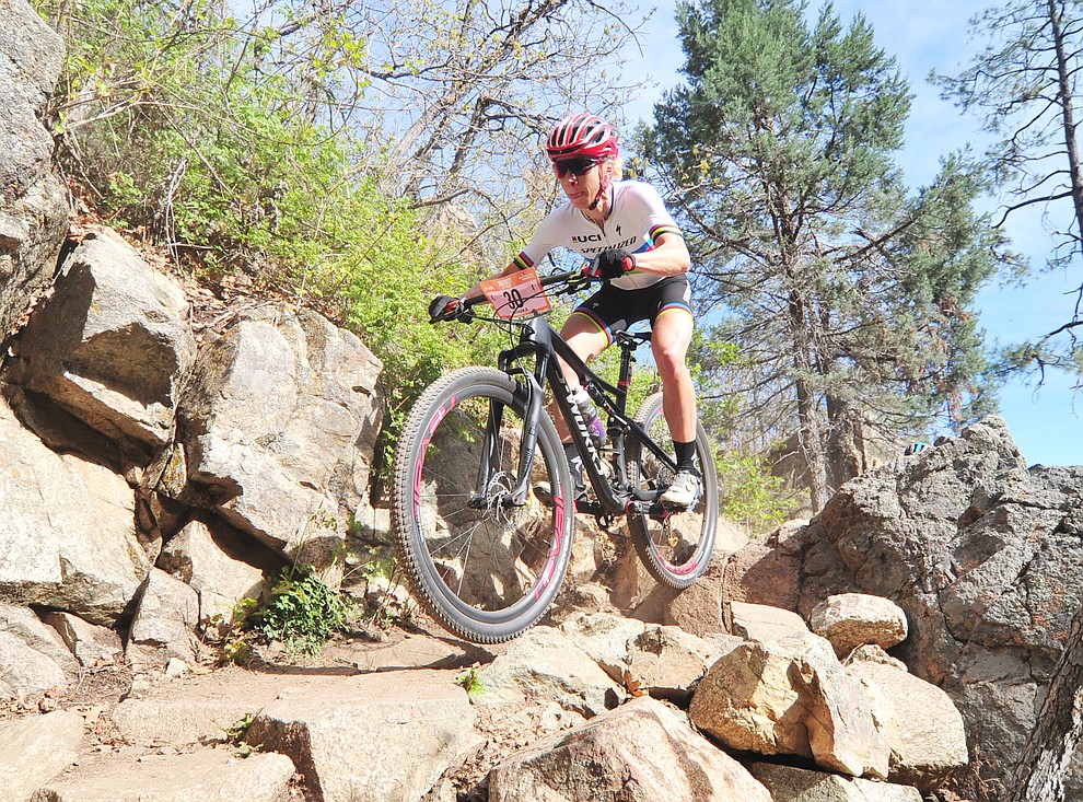Annika Langvad goes through a technical section on trail 48 during the Whiskey Off Road 50 mile professional race in Prescott Sunday, April 29, 2018. (Les Stukenberg/Courier)
