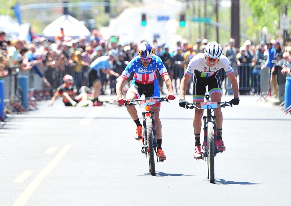 Jerry Dufour and Payson McIlveen battle to the line as riders are down behind them during the Whiskey Off Road 50 mile professional race in Prescott Sunday, April 29, 2018. (Les Stukenberg/Courier)