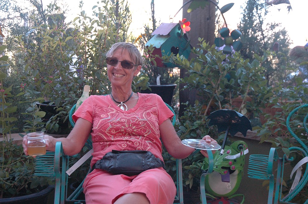 Beth Hopkinson relaxes at Wine, Bites & Brew at Earthworks Garden Supply in Chino Valley Saturday, April 28. (Jason Wheeler/Courier)