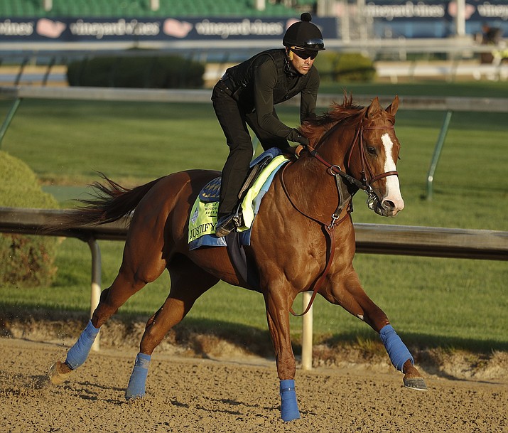 Kentucky Derby hopeful Justify runs during a morning workout at Churchill Downs Tuesday, May 1, 2018, in Louisville, Ky. The 144th running of the Kentucky Derby is scheduled for Saturday, May 5. (AP Photo/Charlie Riedel)