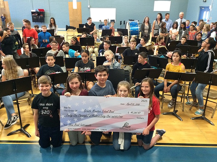 Granite Mountain School band officers show off the check for $41,261 presented Wednesday, April 25, by the Jewish Community Foundation of Greater Prescott to purchase band instruments for the school. From left, Jonah Zajk, Megan Dachenhausen, Taft Mangum, Marlee Breen, and Devyn Whittemore. (Sue Tone/Courier)