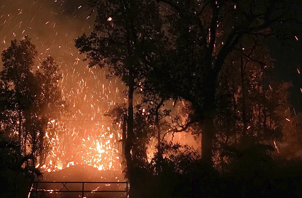 This photo provided by Shane Turpin shows results of the eruption from Kilauea Volcano on Hawaii's Big Island Friday, May 4, 2018. The eruption sent molten lava through forests and bubbling up from paved streets and forced the evacuation of about 1,500 people who were still out of their homes Friday after Thursday's eruption. (Shane Turpin/seeLava.com)