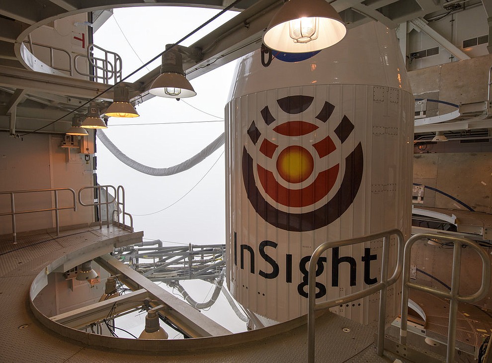 In this image released by NASA, a United Launch Alliance (ULA) Atlas-V rocket with NASA's InSight onboard awaits launch, Friday, May 4, 2018, at Vandenberg Air Force Base, Calif. The rocket is set to launch early Saturday. (Bill Ingalls/NASA via AP)