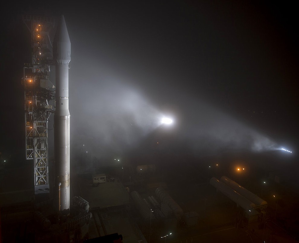 This photo released by NASA shows a United Launch Alliance (ULA) Atlas-V rocket with NASA's InSight spacecraft onboard shortly after the mobile service tower was rolled back, Friday, May 4, 2018, at Vandenberg Air Force Base in Calif. The rocket is set to launch early Saturday. (Bill Ingalls/NASA via AP)