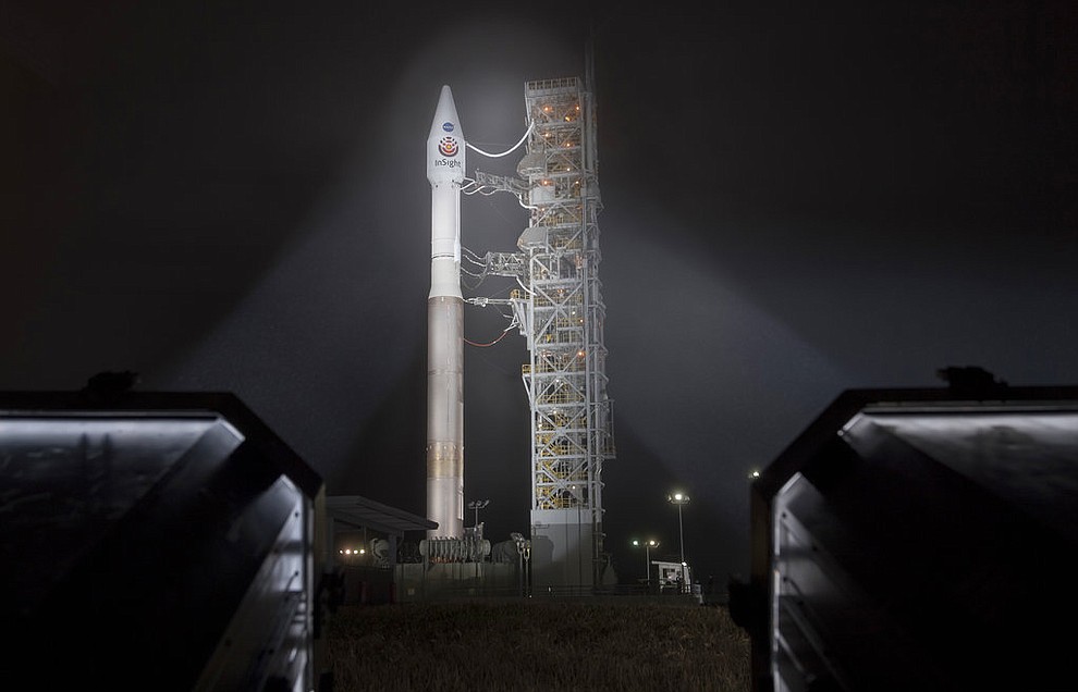 This photo released by NASA shows a United Launch Alliance (ULA) Atlas-V rocket with NASA's InSight spacecraft onboard shortly after the mobile service tower was rolled back, Friday, May 4, 2018, at Vandenberg Air Force Base in Calif. The rocket is set to launch early Saturday. (Bill Ingalls/NASA via AP)