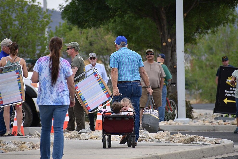 Military families and other members of the public gather to cheer on National Guard Infantry Unit Charlie Company 1st Battalion-158 as they parade around the Civic Center in Prescott Valley on Sunday, May 6, 2018 in anticipation of their deployment to Afghanistan. (Richard Haddad/WNI)