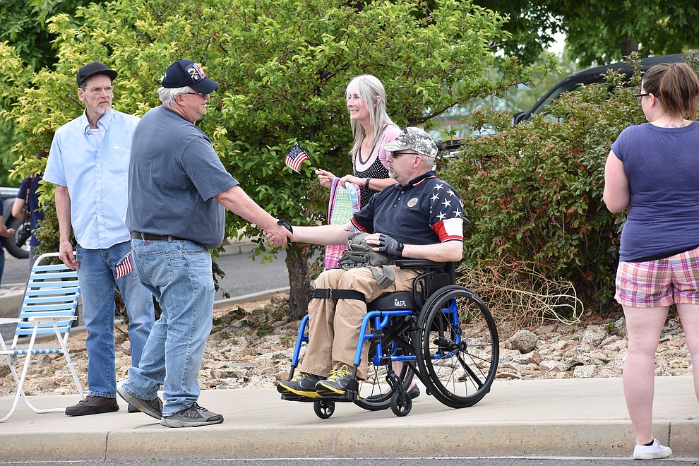 Military families and other members of the public gather to cheer on National Guard Infantry Unit Charlie Company 1st Battalion-158 as they parade around the Civic Center in Prescott Valley on Sunday, May 6, 2018 in anticipation of their deployment to Afghanistan. (Richard Haddad/WNI)