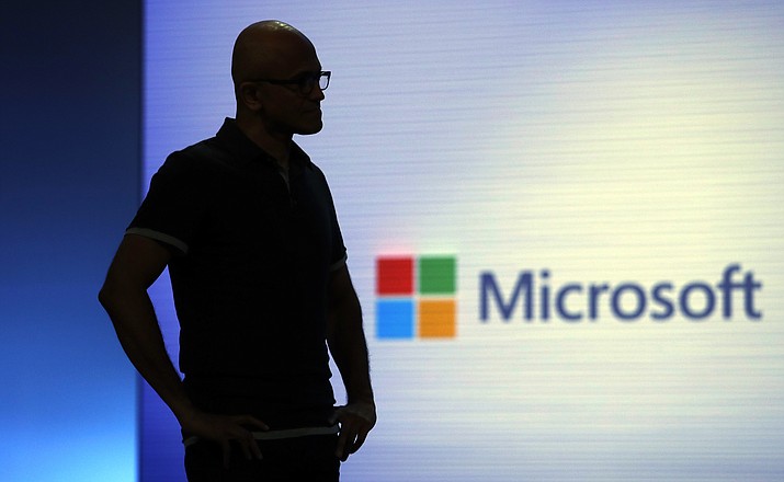 Microsoft CEO Satya Nadella looks on during a video as he delivers the keynote address at Build, the company's annual conference for software developers Monday, May 7, 2018, in Seattle. (AP Photo/Elaine Thompson)

