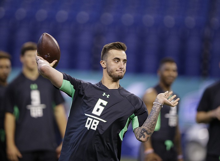 Western Kentucky quarterback Brandon Doughty runs a drill at the NFL football scouting combine Feb. 27, 2016, in Indianapolis. Doughty was released by the Arizona Cardinals on Monday, May 7, 2018. (Darron Cummings/AP, File)