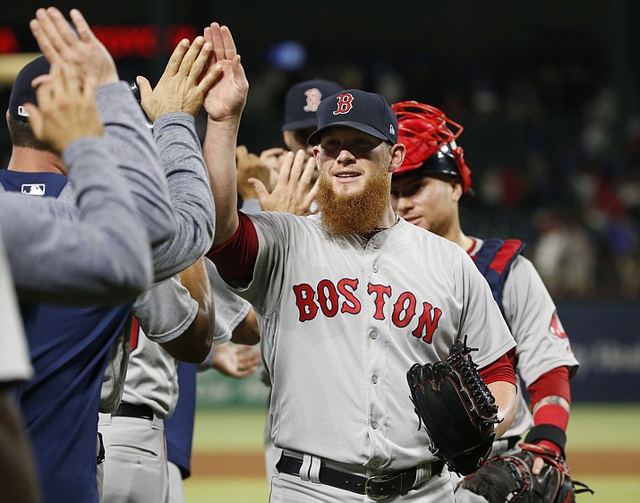 Boston Red Sox relief pitcher Craig Kimbrel is congratulated by teammates after the Red Sox defeated the Texas Rangers 6-5 in a baseball game Saturday, May 5, 2018, in Arlington, Texas. (Michael Ainsworth/AP, File)