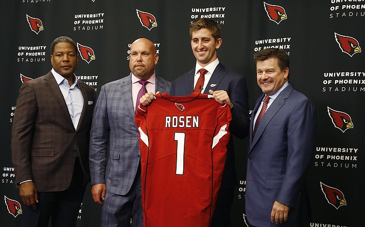 The Arizona Cardinals introduce their first-round NFL football draft pick Josh Rosen, second from right, as he poses for a photograph with head coach Steve Wilks, left, general manager Steve Keim, second from left, and team president Michael Bidwill, right, Friday, April 27, 2018, in Tempe. (Ross D. Franklin/AP, File)