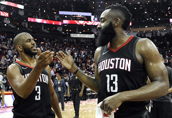 Houston Rockets guard Chris Paul (3) and James Harden celebrate the team’s win over the Utah Jazz during Game 5 of an NBA basketball second-round playoff series Tuesday, May 8, 2018, in Houston. (Eric Christian Smith/AP)