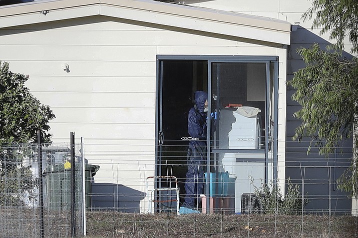 Police forensics investigate the death of seven people in a suspected murder-suicide in Osmington, east of Margaret River, south west of Perth, Australia Friday, May 11, 2018. Seven people including four children were found dead with gunshot wounds Friday at a rural property in southwest Australia in what could be the country's worst mass shooting in 22 years, police said. (Richard Wainwright/AAP Image via AP)

