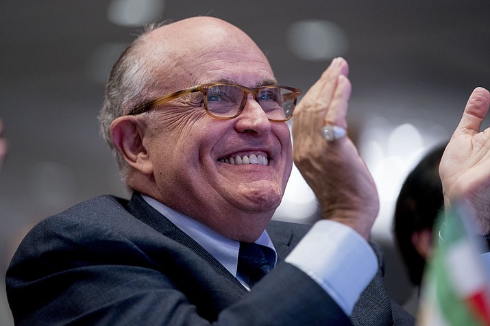 Rudy Giuliani, an attorney for President Donald Trump, applauds at the Iran Freedom Convention for Human Rights and democracy at the Grand Hyatt, Saturday, May 5, 2018, in Washington. (AP Photo/Andrew Harnik)

