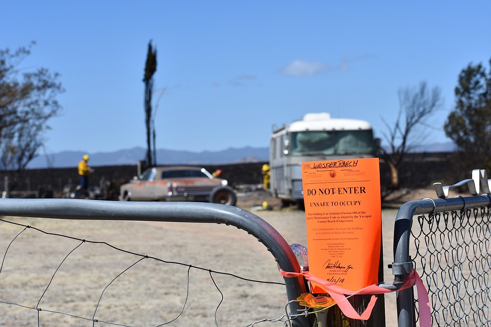 A Yavapai County Development Services notice is seen at the entrance gate of a home destroyed by the May 11, 2018 Viewpoint Fire in the 7000 block of Whisper Ranch Road in the Poquito Valley community of Prescott Valley, Arizona. (Richard Haddad/WNI)