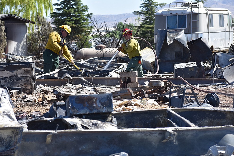 On the morning of May 12, 2018, fire crews put out hot spots on a home destroyed a day earlier by the Viewpoint Fire in the 7000 block of Whisper Ranch Road in the Poquito Valley community of Prescott Valley, Arizona. (Richard Haddad/WNI)