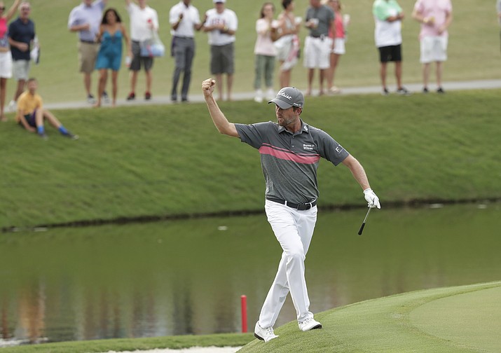 Webb Simpson celebrates an eagle shot on the 11th hole during the third round of The Players Championship golf tournament Saturday, May 12, 2018, in Ponte Vedra Beach, Fla. (John Raoux/AP)