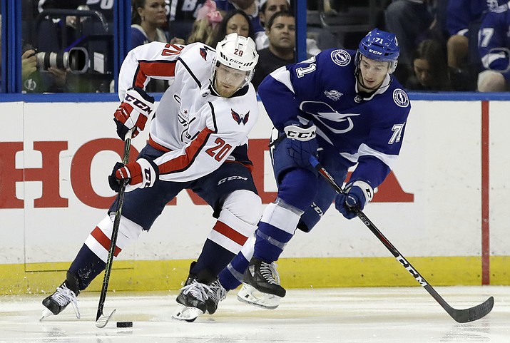 Washington Capitals center Lars Eller (20) cuts around Tampa Bay Lightning center Anthony Cirelli (71) during the second period of Game 2 of the NHL Eastern Conference finals hockey playoff series Sunday, May 13, 2018, in Tampa, Fla. (AP Photo/Chris O'Meara)