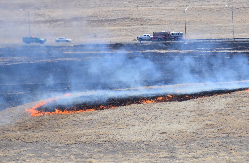 Fire crews battle a wildland fire along Fain Road in Prescott Valley Monday, May 14, 2018. The fire started near the intersection of Fain Road and Lakeshore Drive around 10 a.m. (Richard Haddad/WNI)