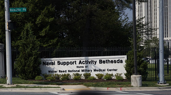 A sign at the gate to Walter Reed National Military Medical Center is seen in Bethesda, Md., Monday, May 14, 2018. First lady Melania Trump underwent a procedure Monday morning to treat a benign kidney condition and will likely be hospitalized for the rest of the week, the White House said. (AP Photo/Carolyn Kaster)

