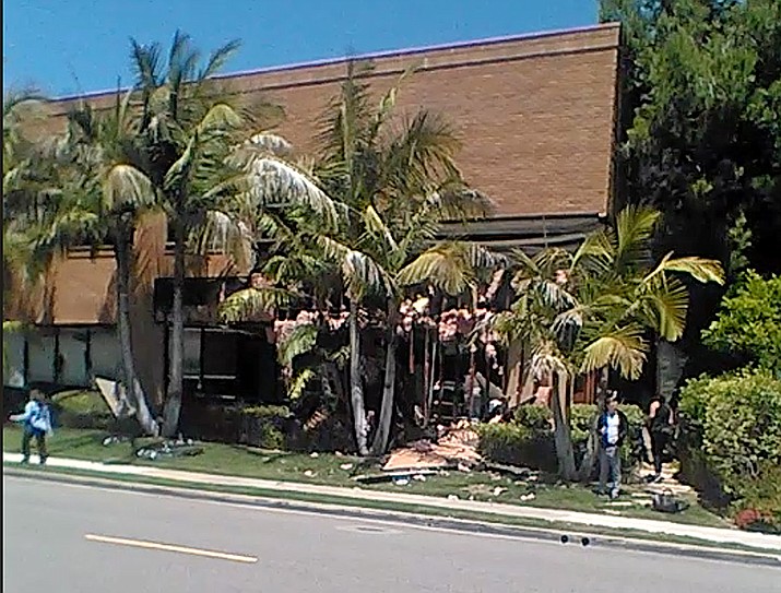 This image taken from cellphone video shows a building after a fatal explosion in Aliso Viejo, Calif., Tuesday, May 15, 2018. The cause of the blast is being investigated. (Raul Hernandez via AP)

