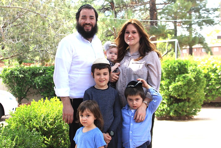 Rabbi Mendel Kessler and his wife Fraydee Kessler with their four children outside their home in Sedona. 