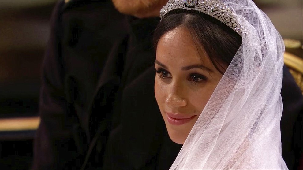 In this frame from video, Meghan Markle listens during her wedding ceremony with Britain's Prince Harry at St. George's Chapel in Windsor Castle in Windsor, near London, England, Saturday, May 19, 2018. (UK Pool/Sky News via AP)