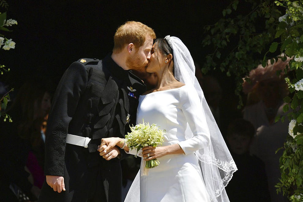 Prince Harry and Meghan Markle leave after their wedding ceremony at St. George's Chapel in Windsor Castle in Windsor, near London, England, Saturday, May 19, 2018. (Ben Birchhall/pool photo via AP)