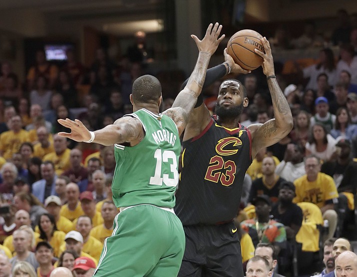 Cleveland Cavaliers’ LeBron James (23) shoots against Boston Celtics’ Marcus Morris (13) in the first half of Game 3 of the NBA basketball Eastern Conference finals, Saturday, May 19, 2018, in Cleveland. (Tony Dejak/AP)