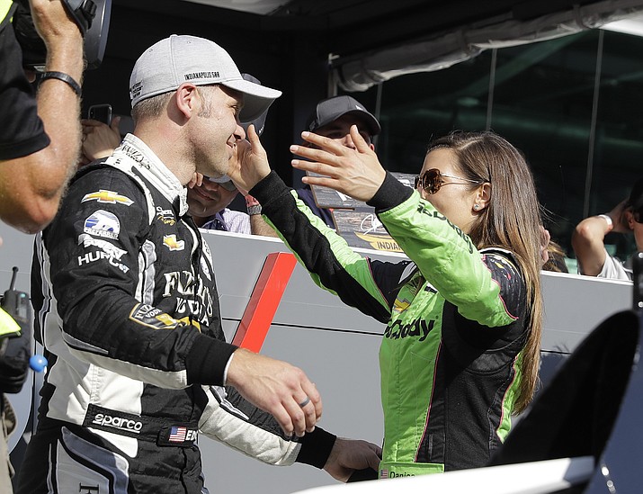 Ed Carpenter is hugged by Danica Patrick after Carpenter won the pole for the IndyCar Indianapolis 500 auto race at Indianapolis Motor Speedway, in Indianapolis Sunday, May 20, 2018. (AP Photo/Darron Cummings)