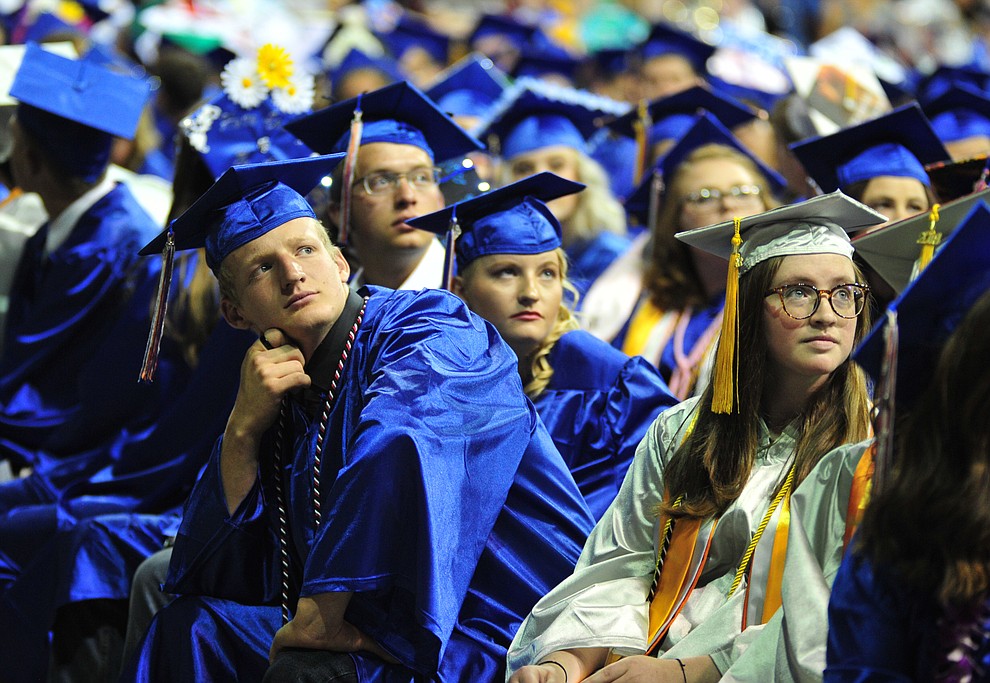 Watching the senior memories video on the big screens at the Chino Valley Commencement held Wednesday, May 23, 2018 at the Prescott Valley Event Center. (Les Stukenberg/Courier)