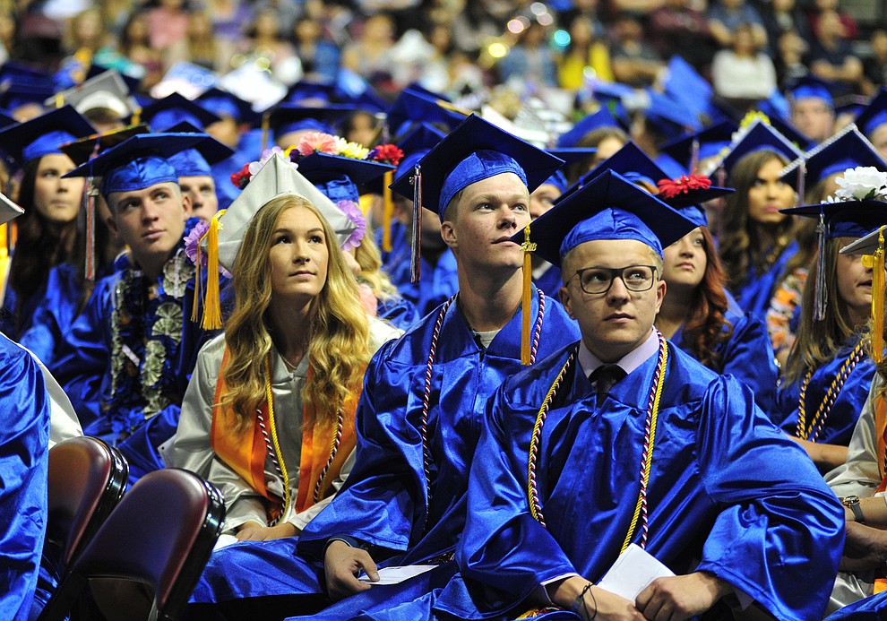 Watching the senior memories video on the big screens at the Chino Valley Commencement held Wednesday, May 23, 2018 at the Prescott Valley Event Center. (Les Stukenberg/Courier)